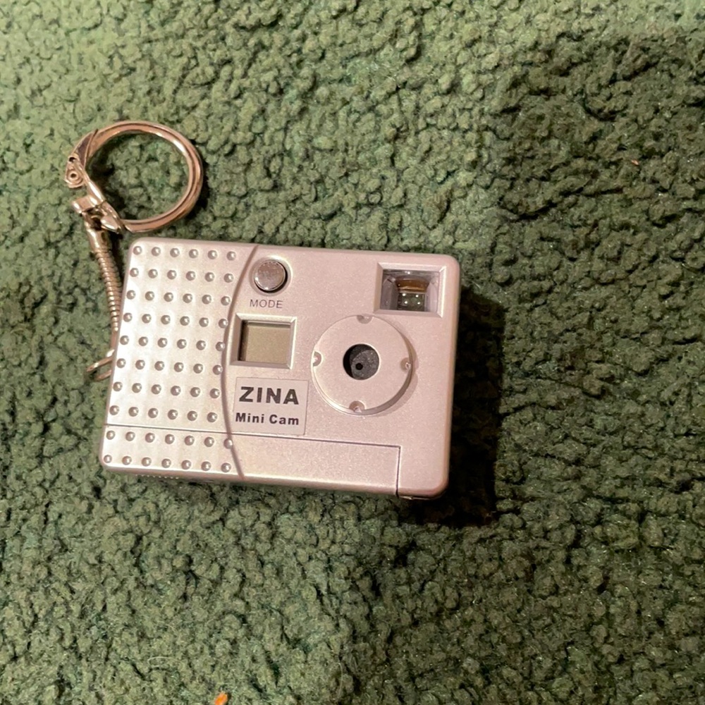 Key chain mini camera with charger.